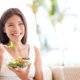 photo of woman eating a salad, good nutrition for gene expression