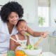 photo of mother and daughter preparing healthy food